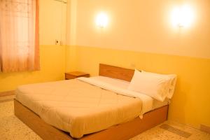Postel nebo postele na pokoji v ubytování Kim Jek Cin 2 Hotel - โรงแรมกิมเจ็กซิน2