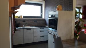 Kuchyň nebo kuchyňský kout v ubytování Apartment Am Eck
