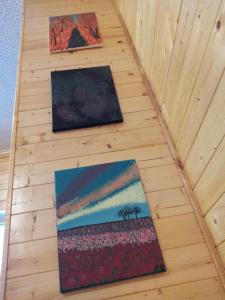 two paintings on the floor of a room at Schoolhouse Inn in Killaloe Station