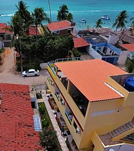 an aerial view of a house with a red roof at Flats Parada Obrigatoria in Maragogi