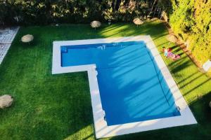 an overhead view of a pool in the grass at Ocean view, Luxury & Relax Dunas de Artola in Marbella