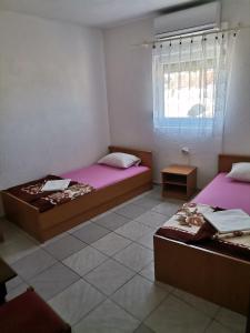 Postel nebo postele na pokoji v ubytování Danijela