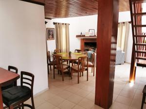 a dining room with a table and chairs at La Cabaña - Samaipata in Samaipata