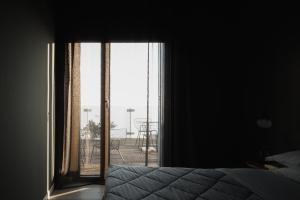 Postel nebo postele na pokoji v ubytování Dreams Hotel Città Studi
