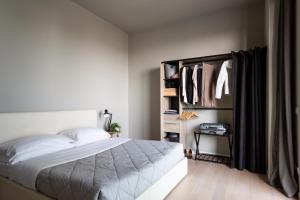 Postel nebo postele na pokoji v ubytování Dreams Hotel Città Studi