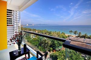 a balcony with a view of the ocean at Golden Lotus Hotel in Nha Trang