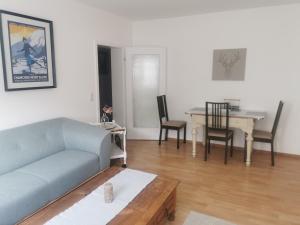 a living room with a couch and a table at Schwarzwaldmarie Ferienwohnung in Löffingen