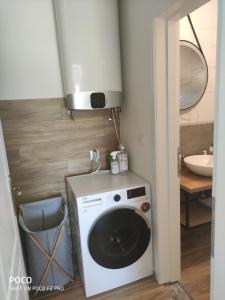 a washing machine in a bathroom with a sink at Holiday Home - Boanerges Heritage in Blato na Cetini +40 photos