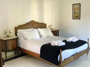 Säng eller sängar i ett rum på Posada Los Angelos