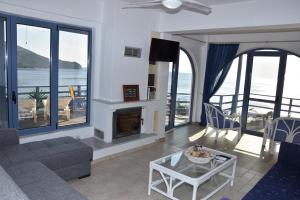 a living room with a view of the ocean at LikoremaView in Marmari