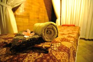 Postel nebo postele na pokoji v ubytování De Munut Balinese Resort