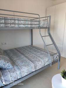 Postel nebo postele na pokoji v ubytování Apartament SomRiu + 13 fotografií