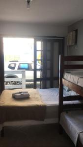 Postel nebo postele na pokoji v ubytování POUSADA BELLA SPIAGGIA