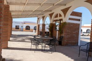 a patio with a table and chairs in a building at Mexican Ambience Townhome with Pool #2 in Puerto Peñasco