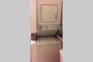 a bathroom with a washing machine and a dryer at Comfy Whole Unit, Private Entrance, Free Parking, Minutes to Georgetown in Washington