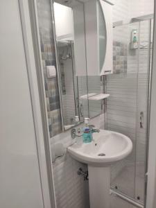 a bathroom with a sink and a shower and a mirror at Villa Ivanovi in Ohrid +53 photos