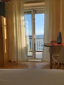 Posteľ alebo postele v izbe v ubytovaní Apartmani Apollo - Drasnice