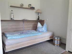 Ένα ή περισσότερα κρεβάτια σε δωμάτιο στο FeWo Meerblick Prora