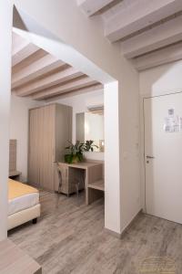 Cama ou camas em um quarto em Locanda Stravedo