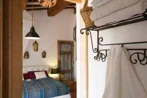 Łóżko lub łóżka w pokoju w obiekcie At Home In Maremma