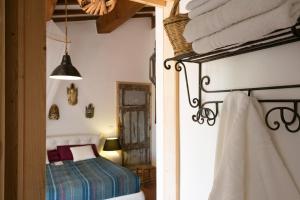 A bed or beds in a room at At Home In Maremma