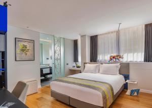 Postel nebo postele na pokoji v ubytování Ultra Tel Aviv Boutique Hotel + 37 fotografií
