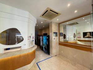 a lobby of a building with a large window at Condedu in Badajoz