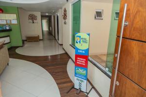 a hallway of a hospital with a sign in the middle at Pousada Brisa do Forte in Cabo Frio
