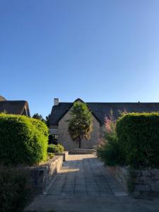 a house with a walkway in front of it at Appartement Golf International de la Baule, Saint Denac, Saint André des Eaux in Saint-André-des-Eaux