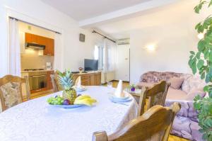 a living room with a table with fruit on it at Apartment in Rovinj/Istrien 11533 in Rovinj