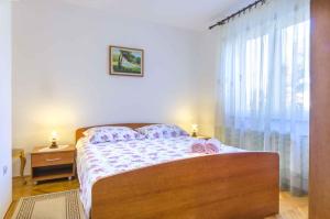 a small bedroom with a bed and a window at Apartment in Rovinj/Istrien 11533 in Rovinj