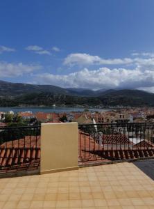a balcony with a view of a city and a river at Barbara΄s Apartments in Argostoli