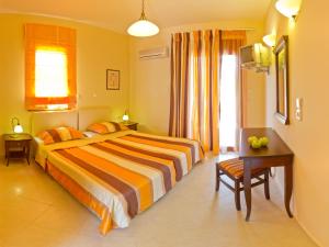 A bed or beds in a room at Eligia Villas