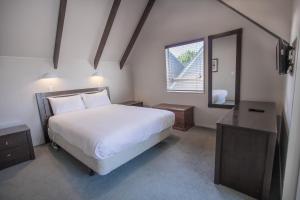 Säng eller sängar i ett rum på Turangi Leisure Lodge
