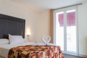 Postel nebo postele na pokoji v ubytování Hotel Posada Guadalupe