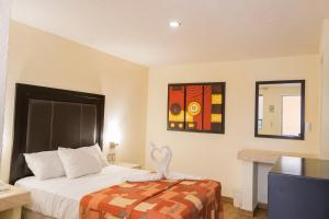 Postel nebo postele na pokoji v ubytování Hotel Posada Guadalupe