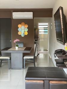 a kitchen with a table and chairs in a room at Departamento Acapulco Diamante in Acapulco