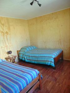 Postel nebo postele na pokoji v ubytování Cabañas Casa Torres
