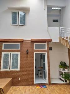 a view of the back of a house with a staircase at Sierra Villa Malang in Malang