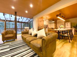 a living room with a couch and a table at Fuji-Kawaguchiko - Diamond Yu in Fujikawaguchiko