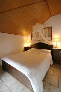 Ένα ή περισσότερα κρεβάτια σε δωμάτιο στο Ξενώνας Μελίτη
