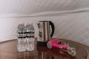 a blender and two bottles of water on a table at Roxy Telok Serabang in Pelaman Siru