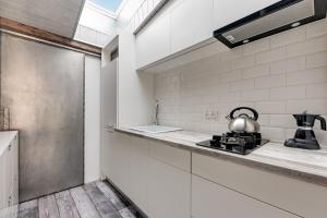 a kitchen with a tea kettle on a counter at Platinium Garncarska Old Town in Gdańsk