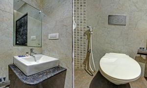 Koupelna v ubytování Treebo Glassotel