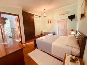 Postel nebo postele na pokoji v ubytování B&B La Pitraia