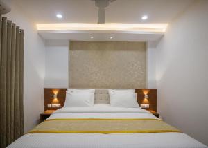 Ένα ή περισσότερα κρεβάτια σε δωμάτιο στο Hotel Laxmi Cityside
