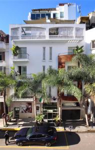 a black car parked in front of a building at Park Suites Hotel & Spa in Casablanca