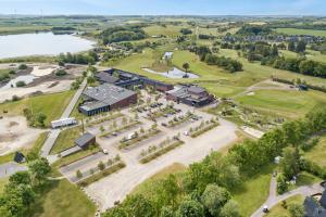 an aerial view of a building with a park at Himmerland Resort Cottages in Farsø