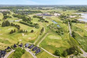 an aerial view of the golf course at the resort at Himmerland Resort Cottages in Farsø