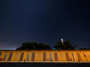 a building with a table in front of it at night at Hotel Shionnoumi in Miyako-jima